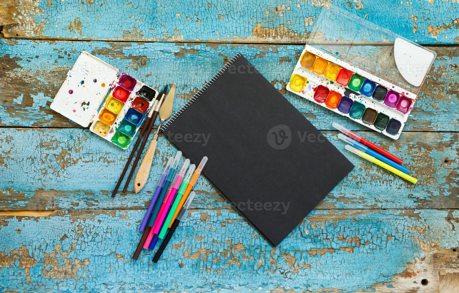 Art painting materials on wooden background photo