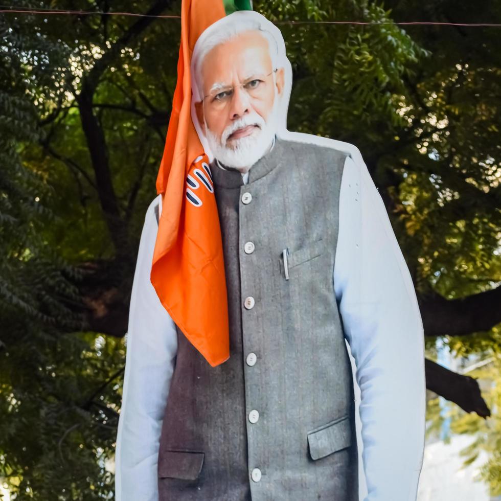 New Delhi, India - January 16 2023 - Prime Minister Narendra Modi cut out during BJP road show, the statue of PM Modi while attending a big election rally in the capital photo
