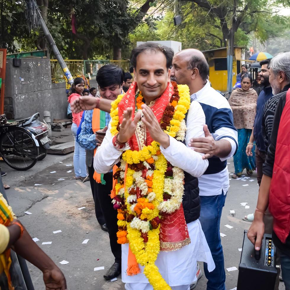 Delhi, India, December 02 2022 -Bharatiya Janata Party BJP supporter during mega road show in support of BJP candidate Pankaj Luthara to file nomination papers ahead of MCD local body Elections 2022 photo