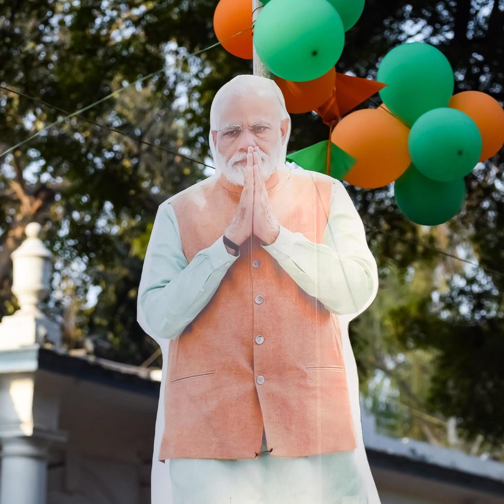 New Delhi, India - January 16 2023 - Prime Minister Narendra Modi cut out during BJP road show, the statue of PM Modi while attending a big election rally in the capital photo