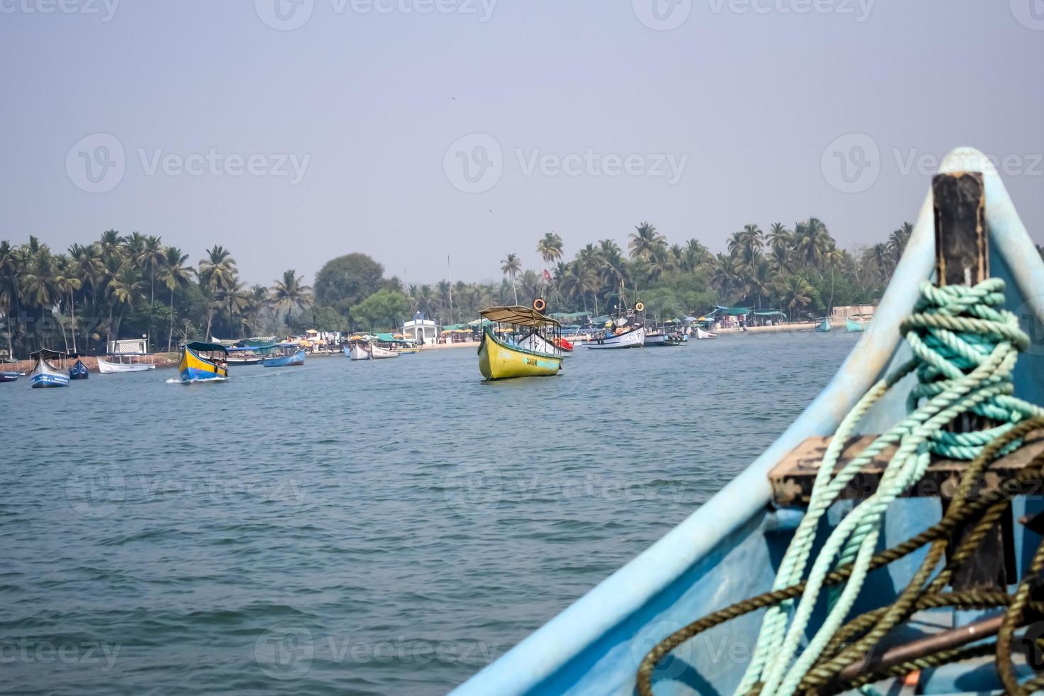 Amazing view from over long tail motor boat in Arabian sea in Goa, India, Ocean view from wooden boat with old ropes photo