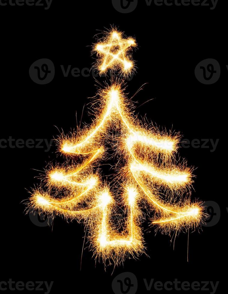 Christmas tree made by sparkler on a black photo