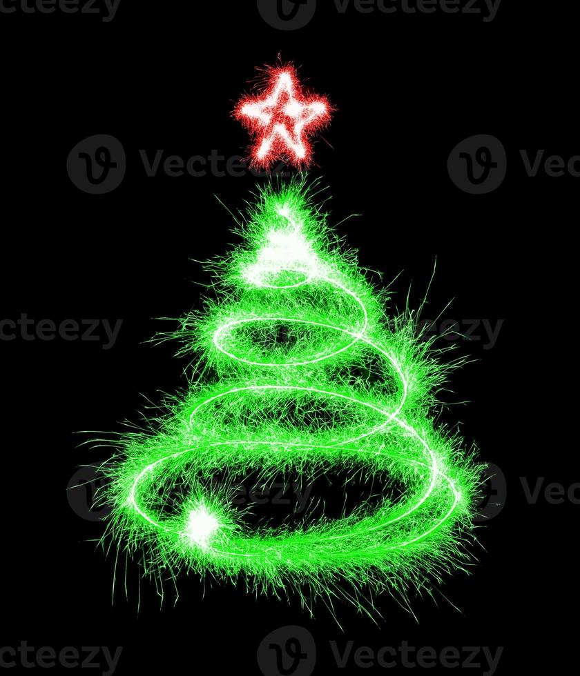 Christmas tree made by sparkler on a black photo