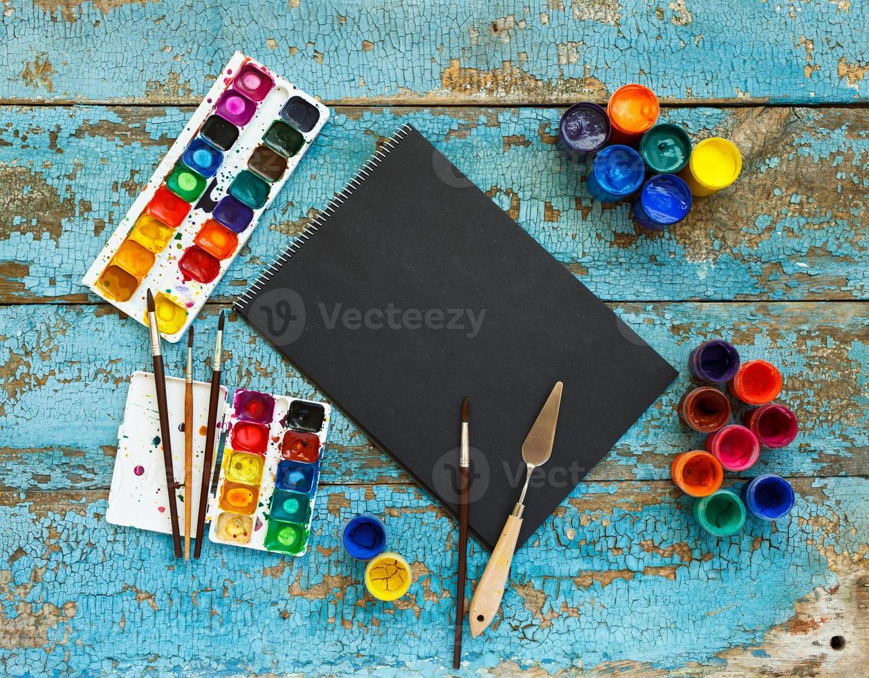 Art painting materials on wooden background photo