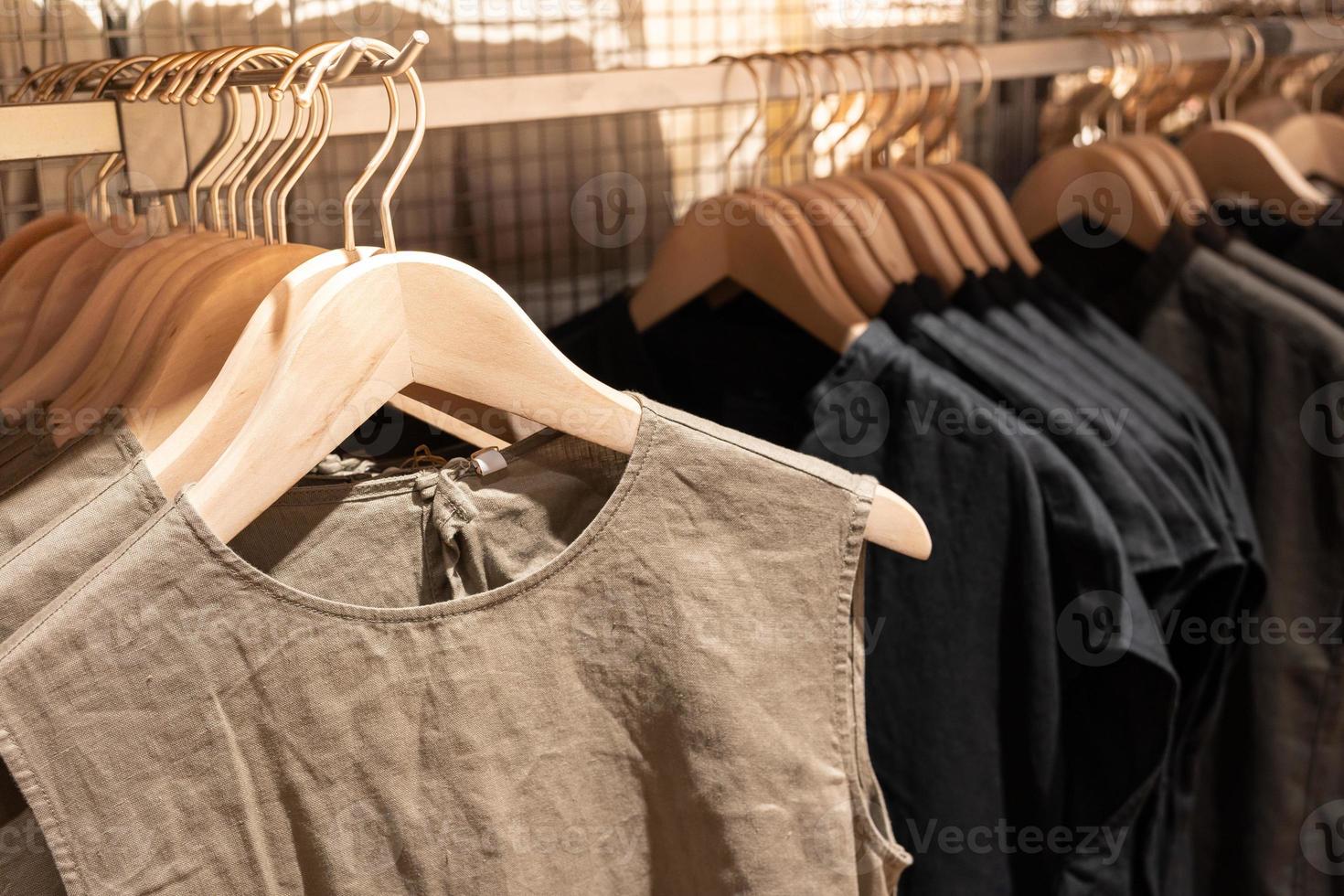 Selective focus, Fashion , clothes concept ,Clothes or pants many colors hang on a shelf in a designer clothes store. Clothing hanging on a clothing rack in a shop. photo