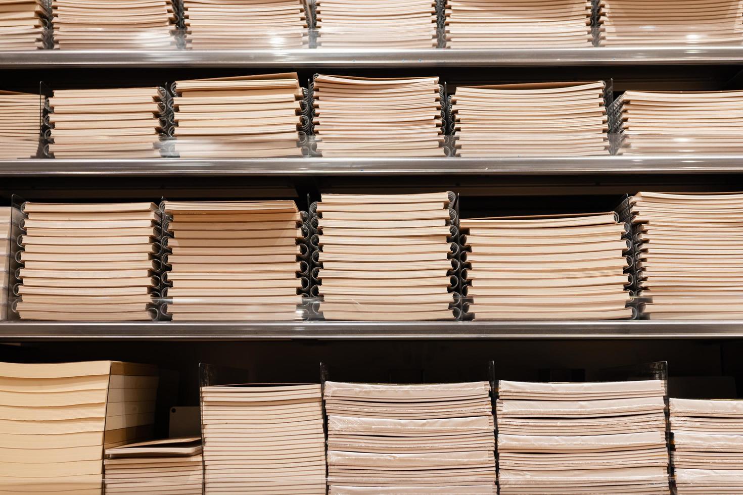 notebooks on the shelves of the store. Stack of notebooks. photo