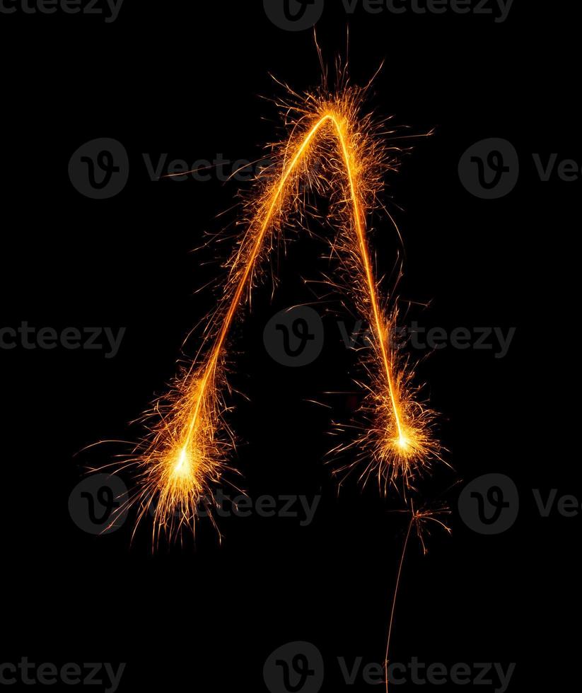 made with sAlphabet element made with sparklers ready for your inscriptions on black background photo