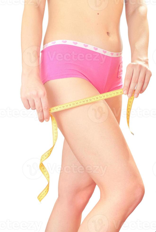 Girl with  measuring tape. photo