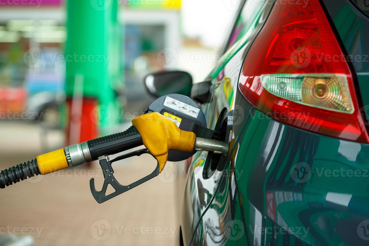 Car refueling on a petrol station close up photo