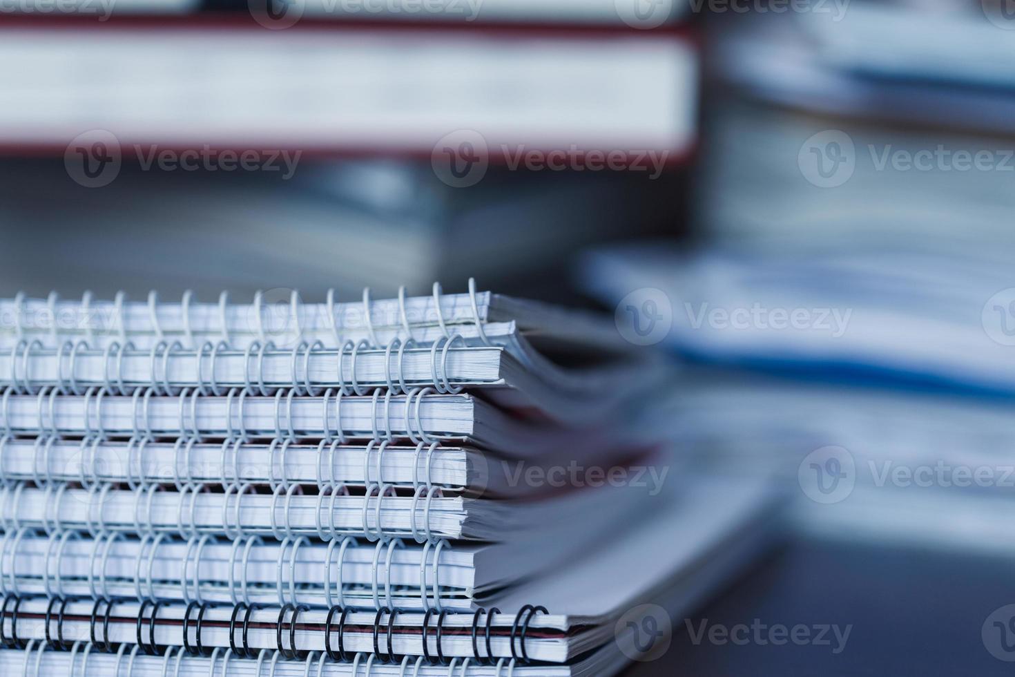 Large pile of magazine, notebook and books closeup photo