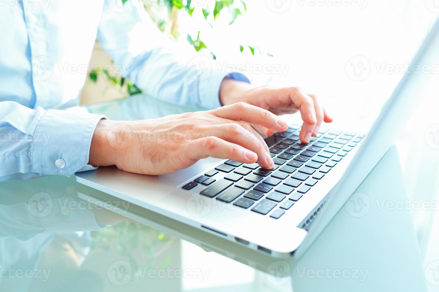 Men office worker typing on the keyboard photo