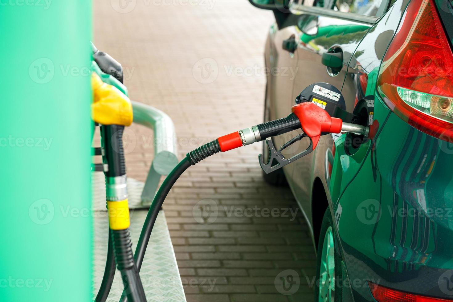 Car refueling on a petrol station photo