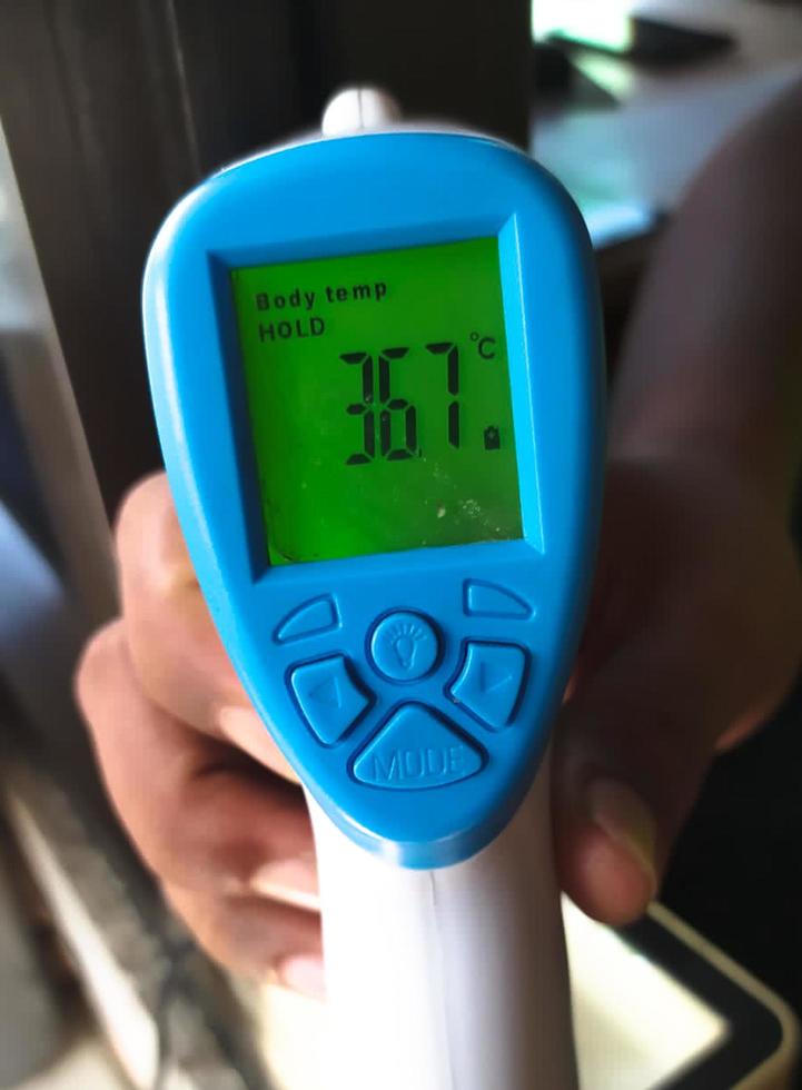 Sidoarjo, Jawa timur, Indonesia, 2023 - results of body temperature screening with a thermo gun photo
