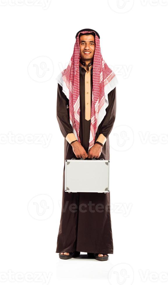 Young smiling arab with a aluminum case isolated on white photo