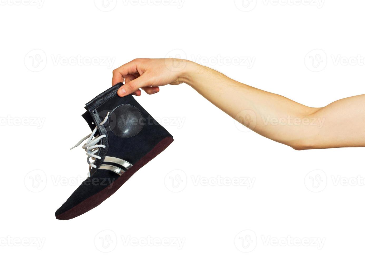 Boxing shoes in hand photo