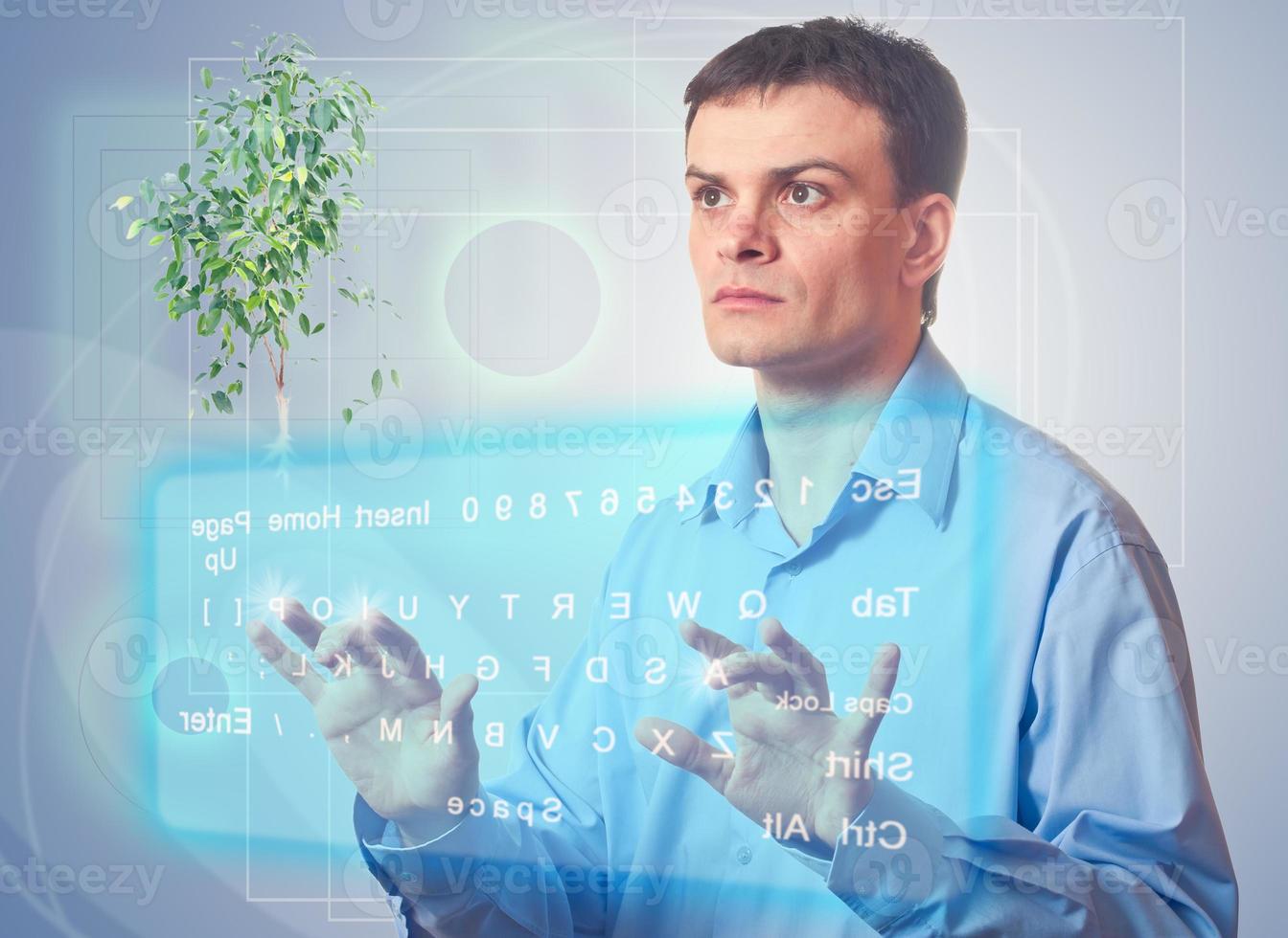 Young man with a virtual keyboard photo