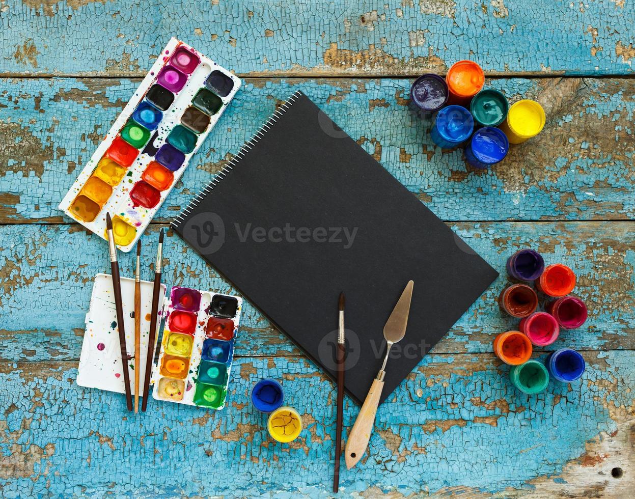 Art painting materials on wooden background photo