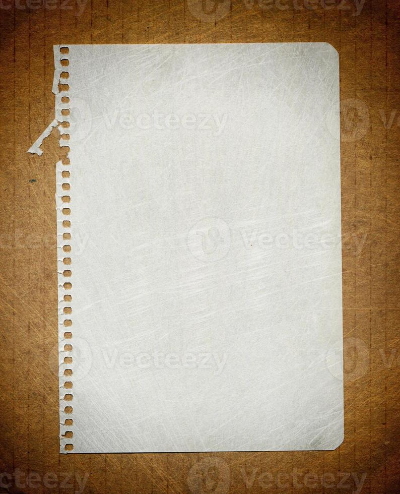 Sheet notebook on the background of corrugated cardboard photo