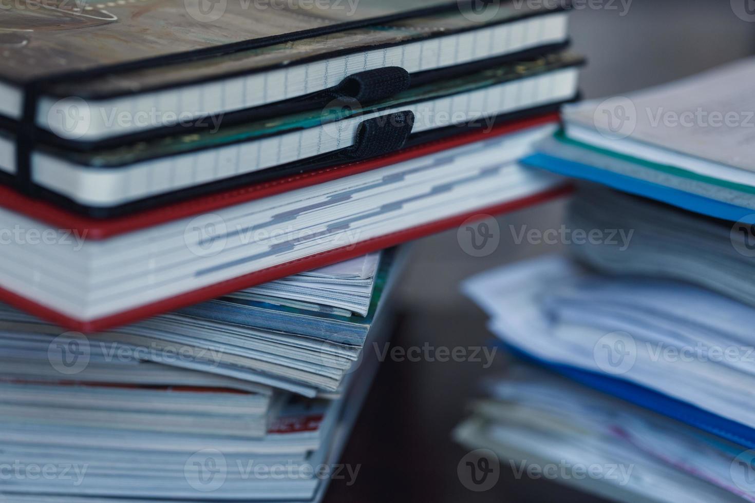Large pile of magazine, notebook and books closeup photo