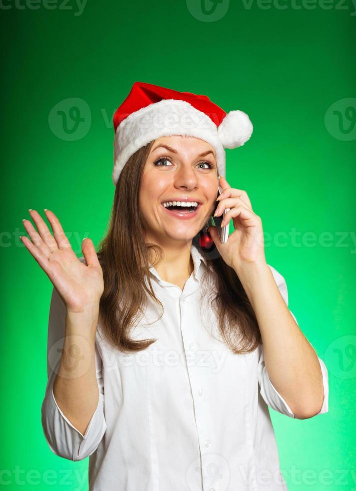 alegre niña en un Navidad sombrero foto