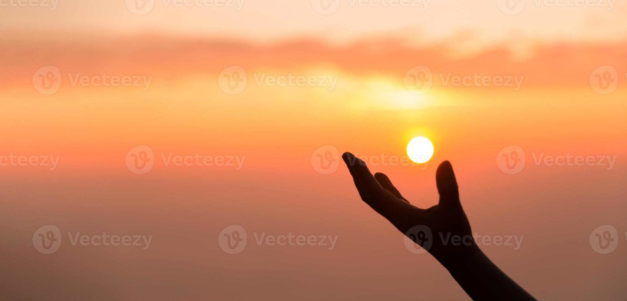 Silhouette of woman hand praying spirituality and religion, banner and copy space of female worship to god. Christianity religion concept. Christians person are pray humility humble to god. photo