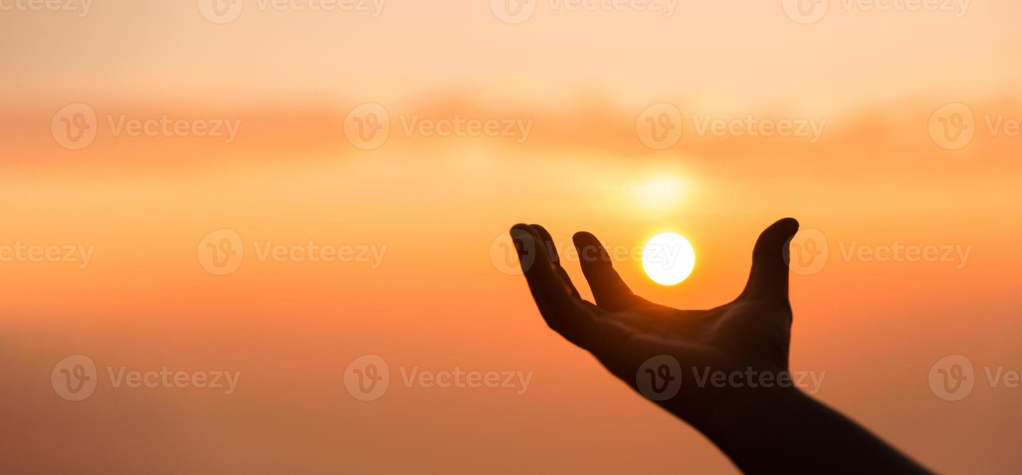 Silhouette of woman hand praying spirituality and religion, banner and copy space of female worship to god. Christianity religion concept. Christians person are pray humility humble to god. photo