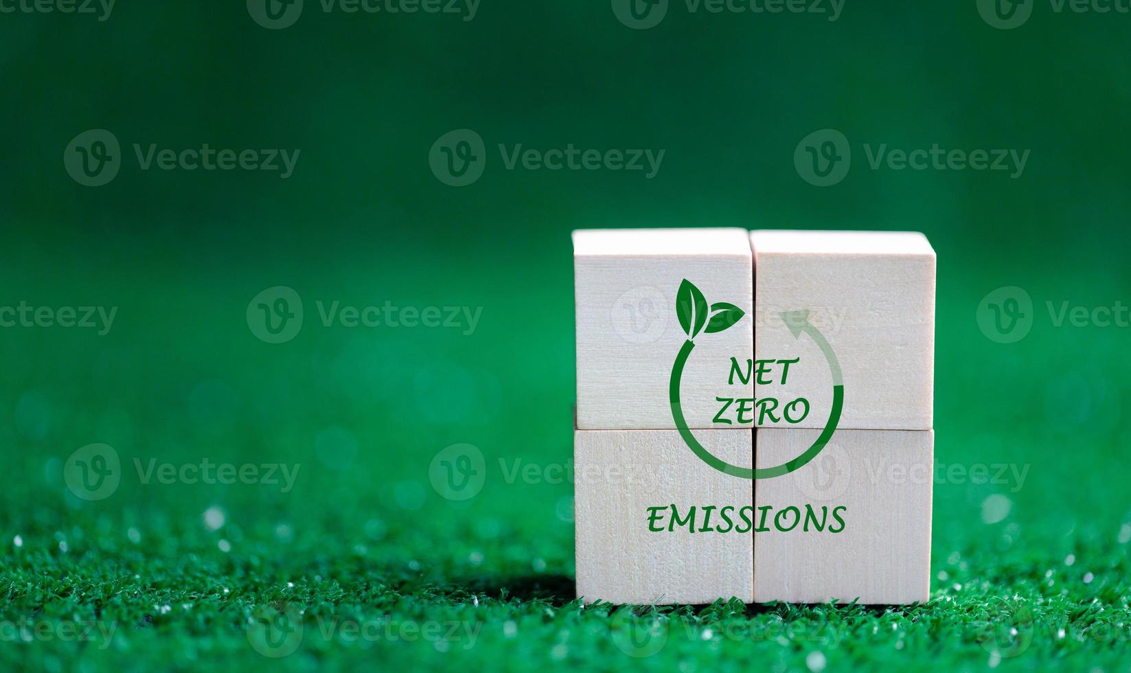 Companies are targeting net zero greenhouse gas emissions. Carbon credit concept.Tradable certificate to drive industry in direction of low emissions in efficiency cost. Wooden cubes with decrease CO2 photo