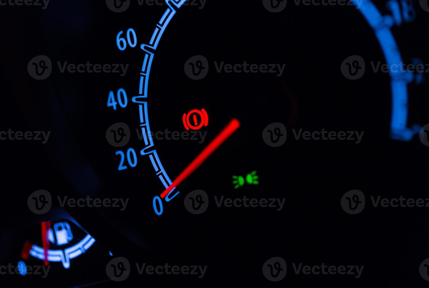 Speedometer illuminated at night photo