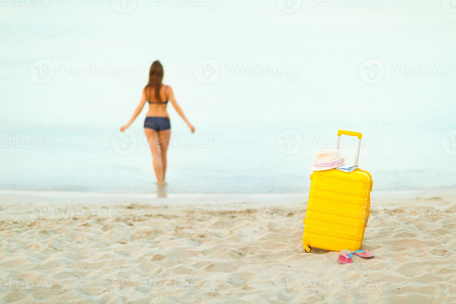 Young woman traveling to the beach photo