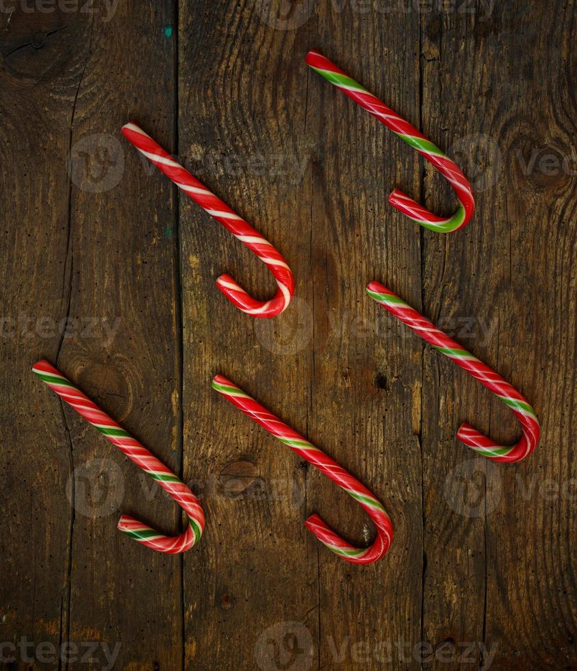 Candy canes on wooden boards photo