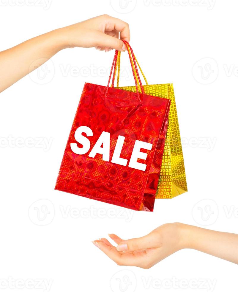 Woman's hands with shopping bags photo