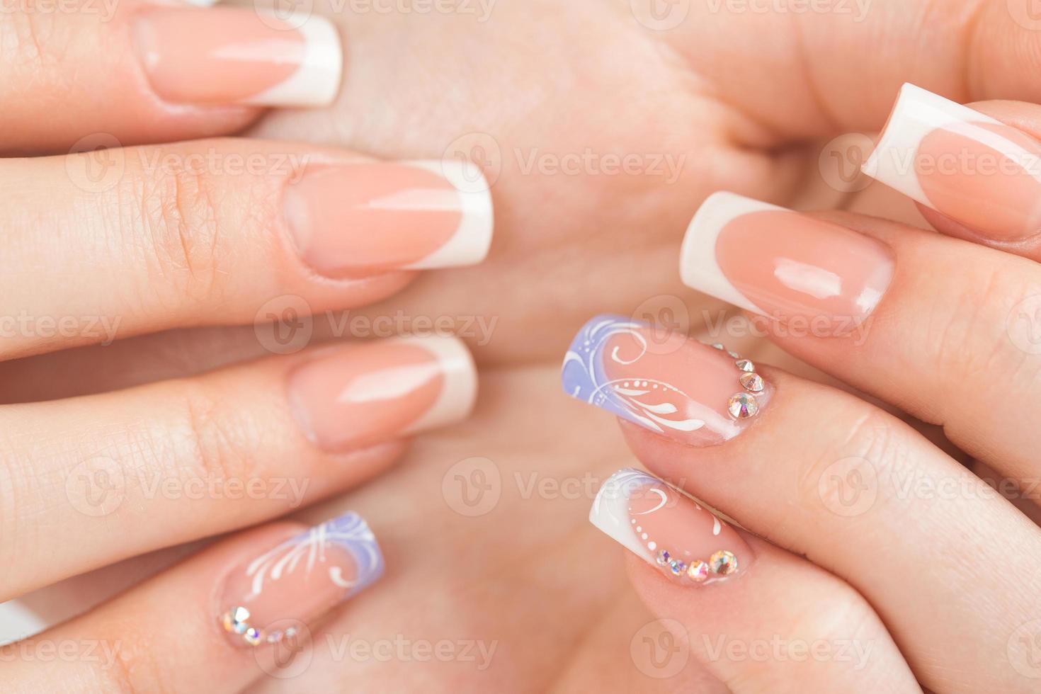 Beautiful female hands with french manicure photo