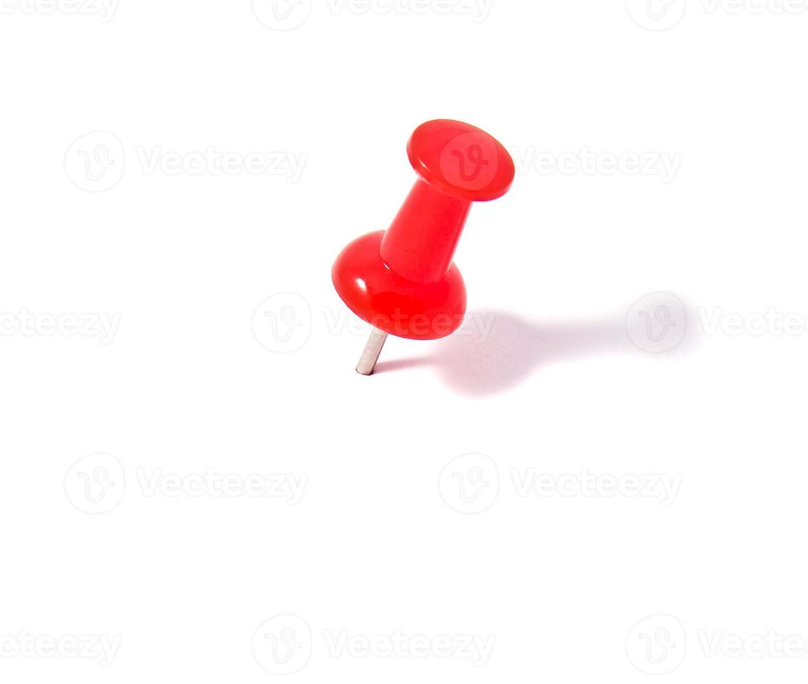 Push pin on white background photo