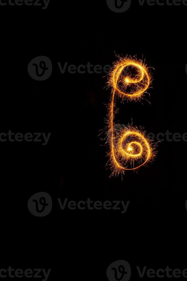 Element made with sparklers ready for your inscriptions on black background photo