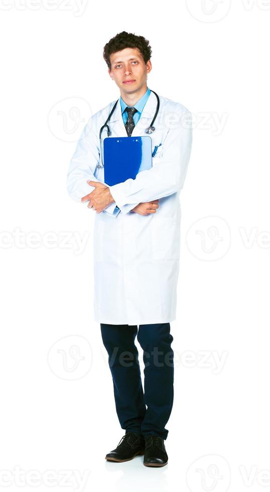 Full length portrait of a male doctor holding a notepad on white photo