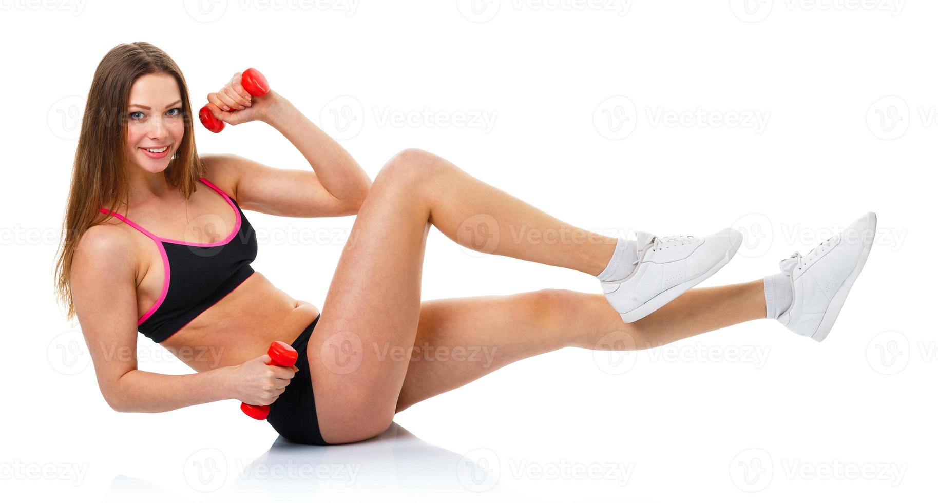 Beautiful sport woman with dumbbells doing sport exercise, isolated on white photo