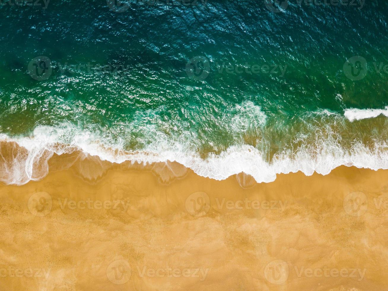 Top view of a deserted beach. The Portuguese coast of the Atlantic Ocean photo