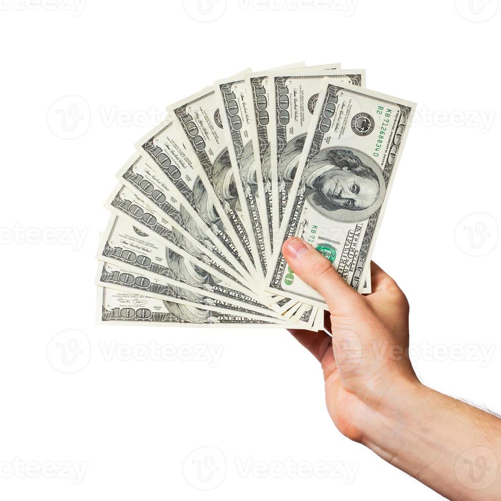 Men's hand holds a fan of dollars photo