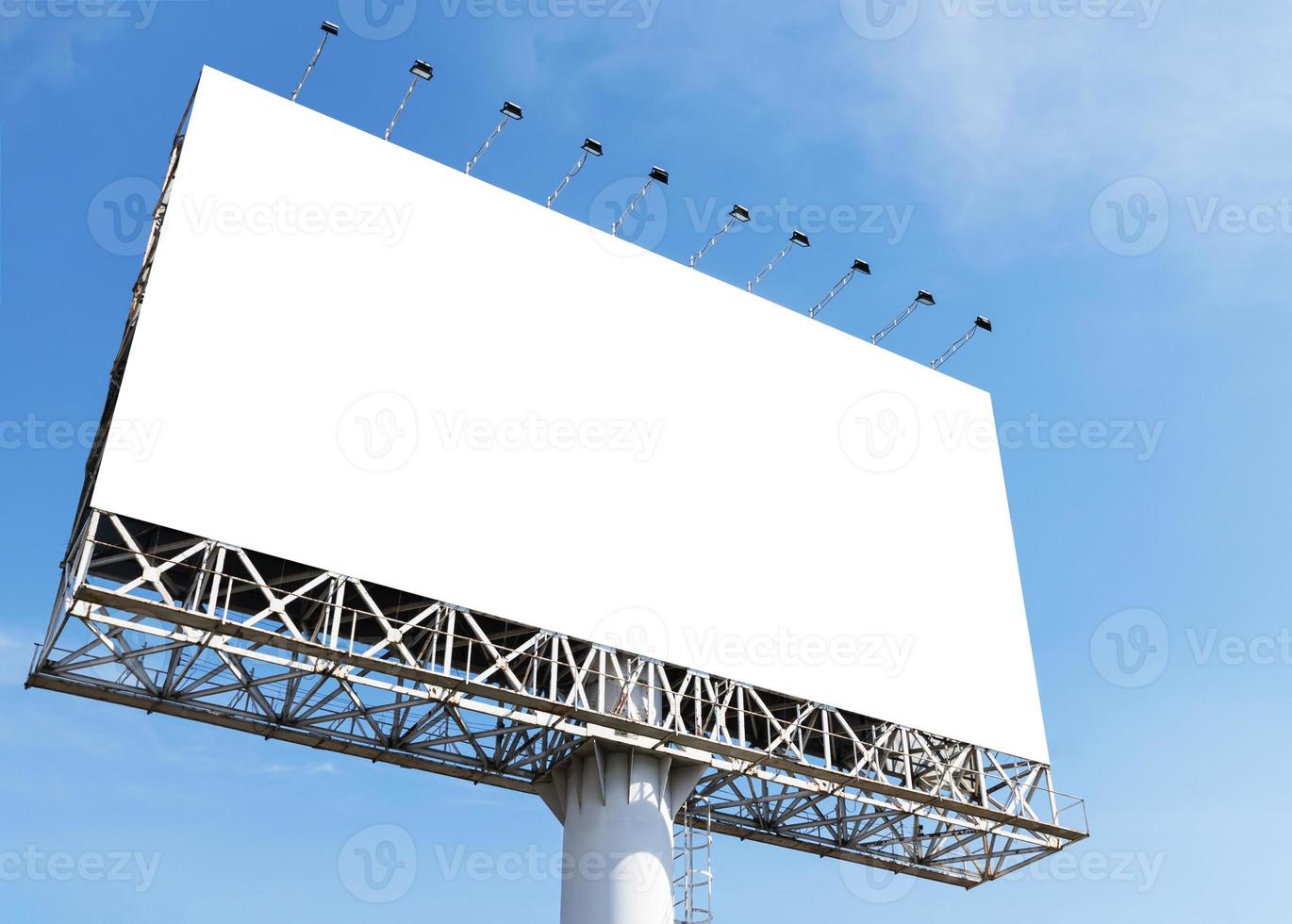 Outdoor pole billboard on blue sky background with mock up white screen and clipping path photo