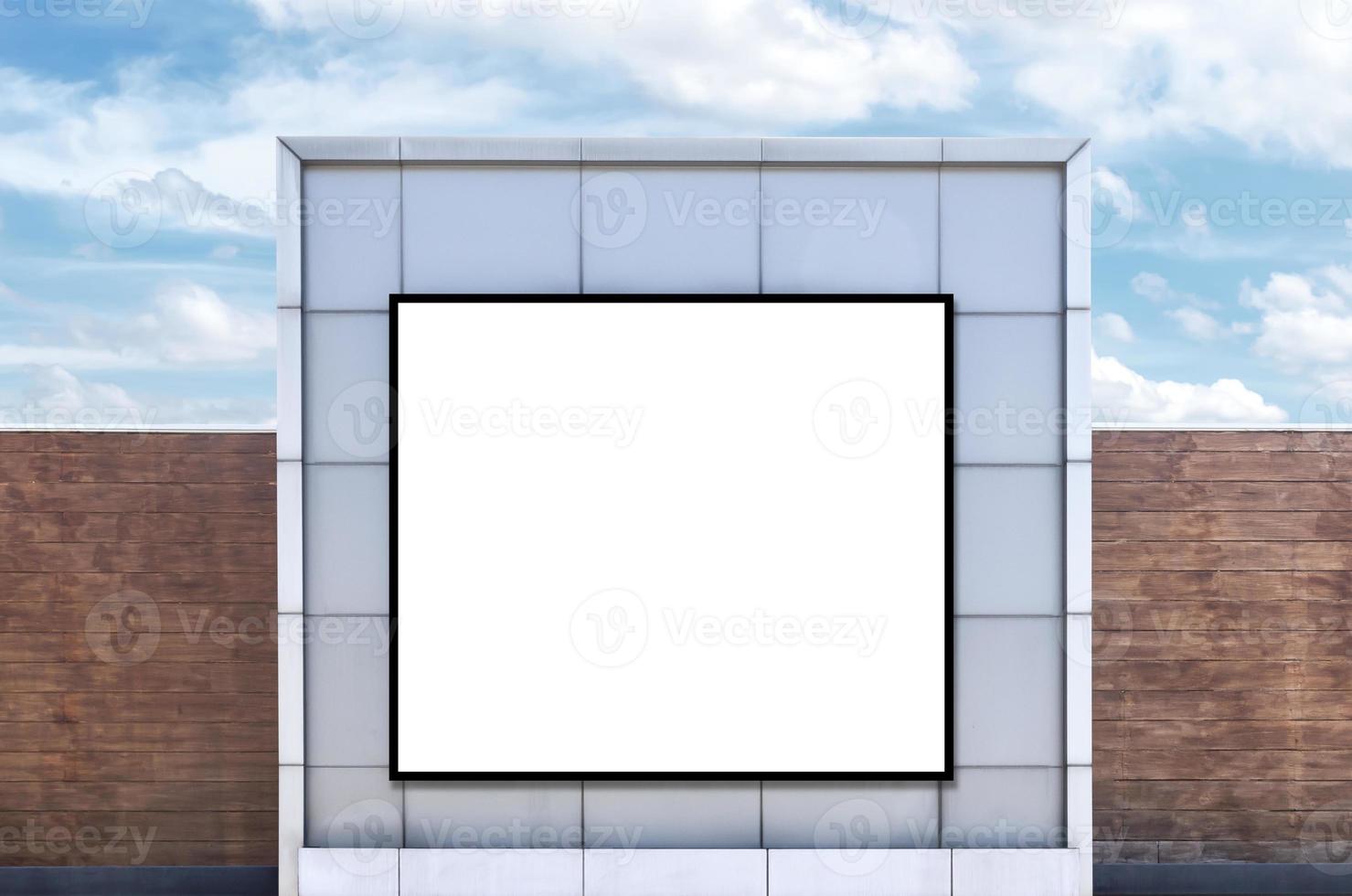 Mock up white background billboard and clipping path on building with blue sky background photo