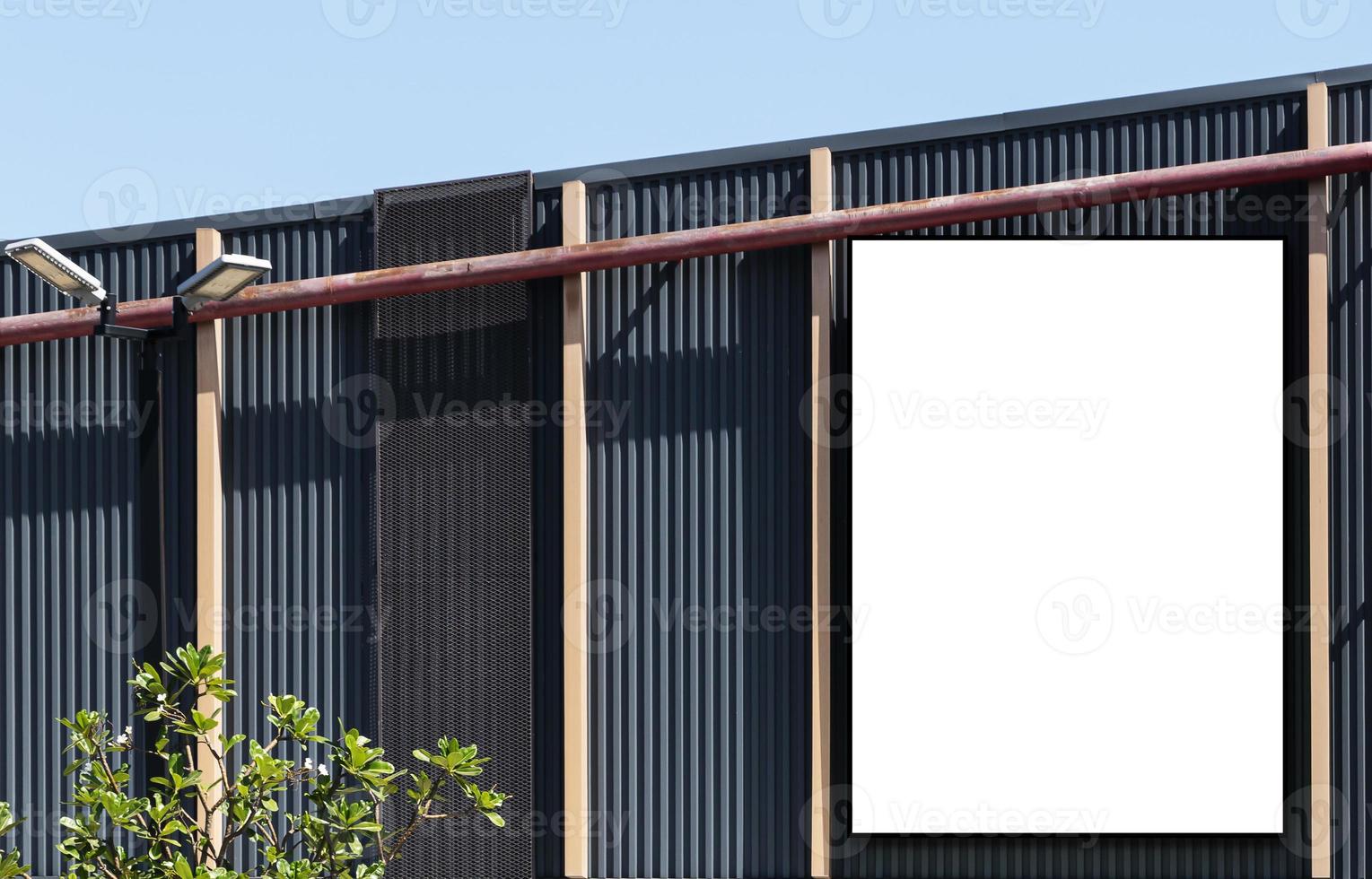 Mock up white background billboard and clipping path on building with blue sky background photo