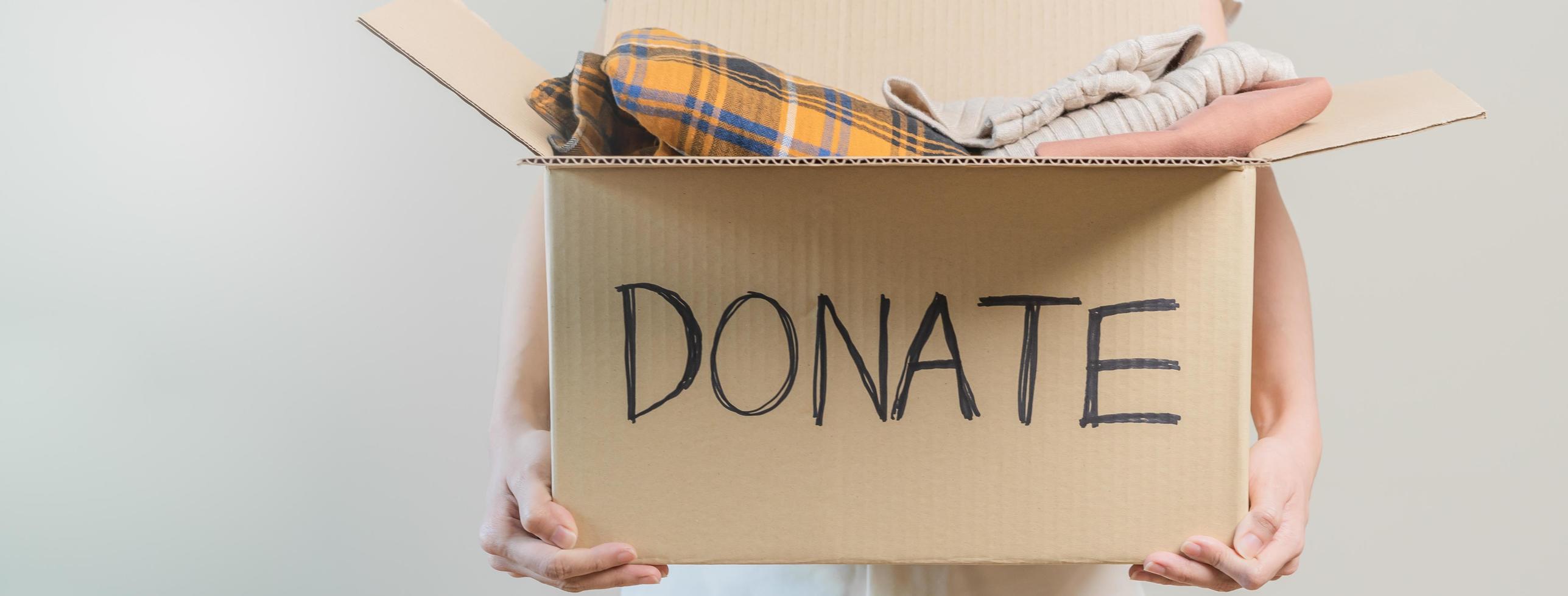 Recycling, Donation for poor, asian young woman pack, hand in holding donate box full with second hand clothes, charity helping and needy people. Reuse recycle, moving of object on white background. photo