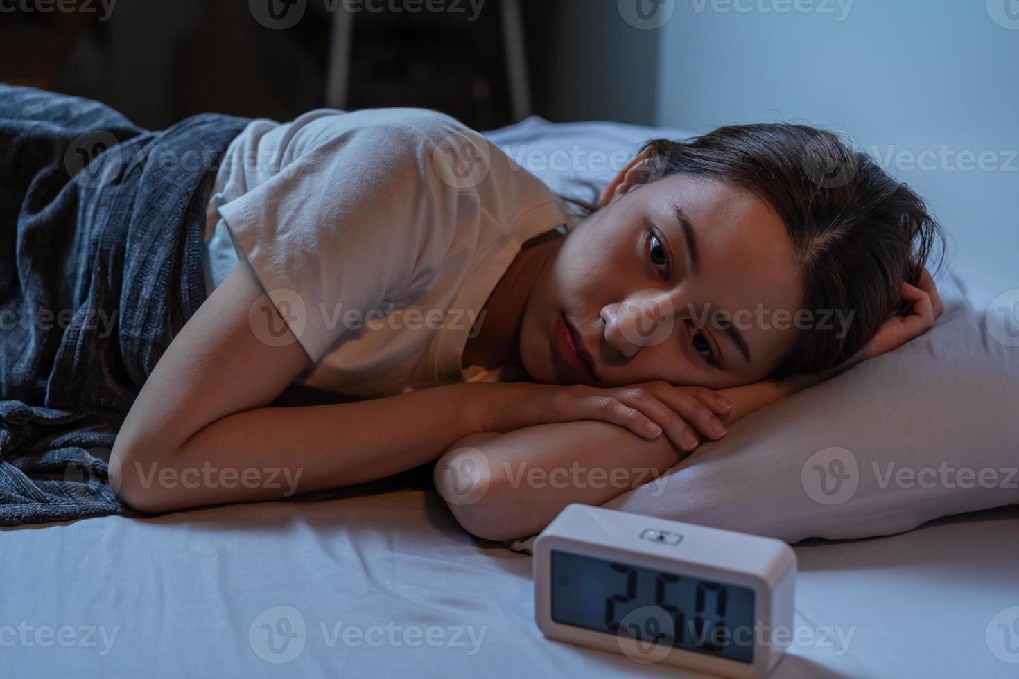 Sweet dream. Asleep, sleep asian young woman, girl under blanket, suffering from insomnia, awake at night in bedroom, tired and exhausted. Frustrated people with problem, exhausted on nightmares. photo