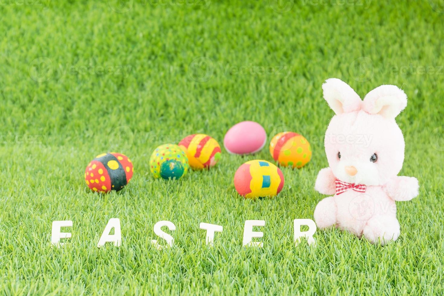 Bunny toy and Easter eggs with text photo