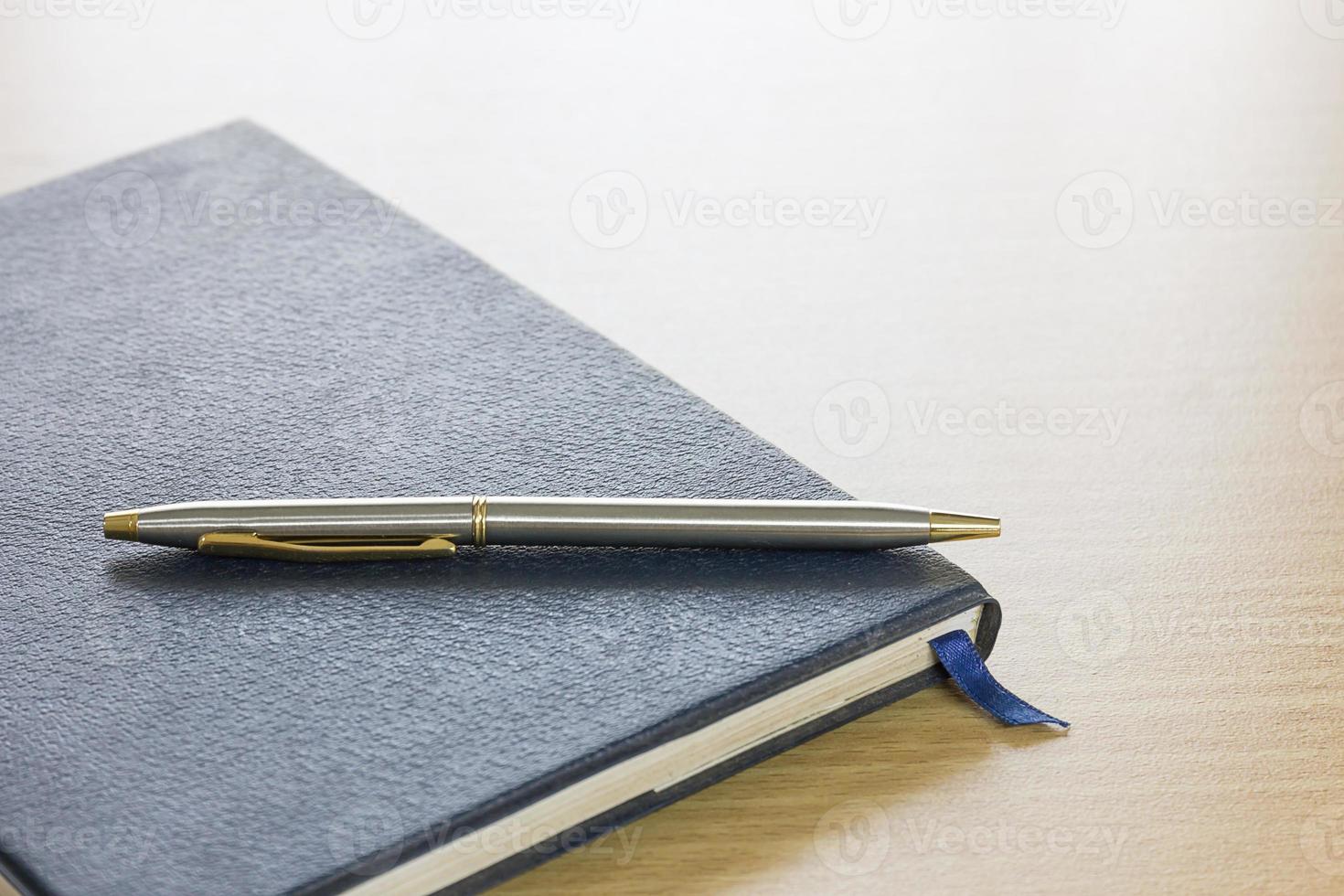 Pen on a book photo