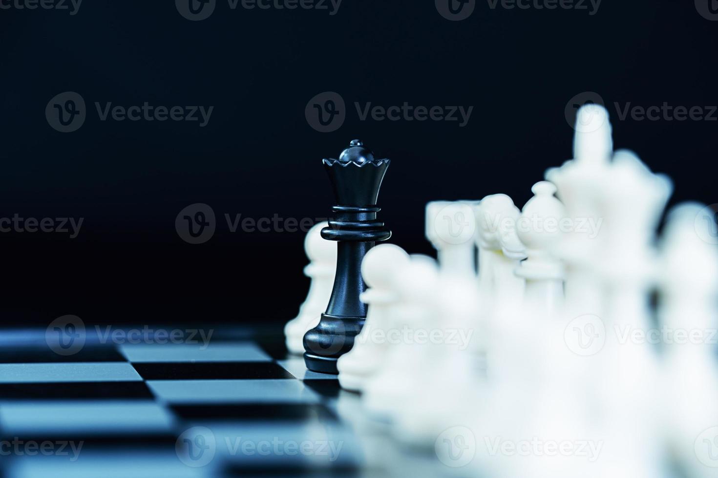 Close up chess pieces on chessboard photo