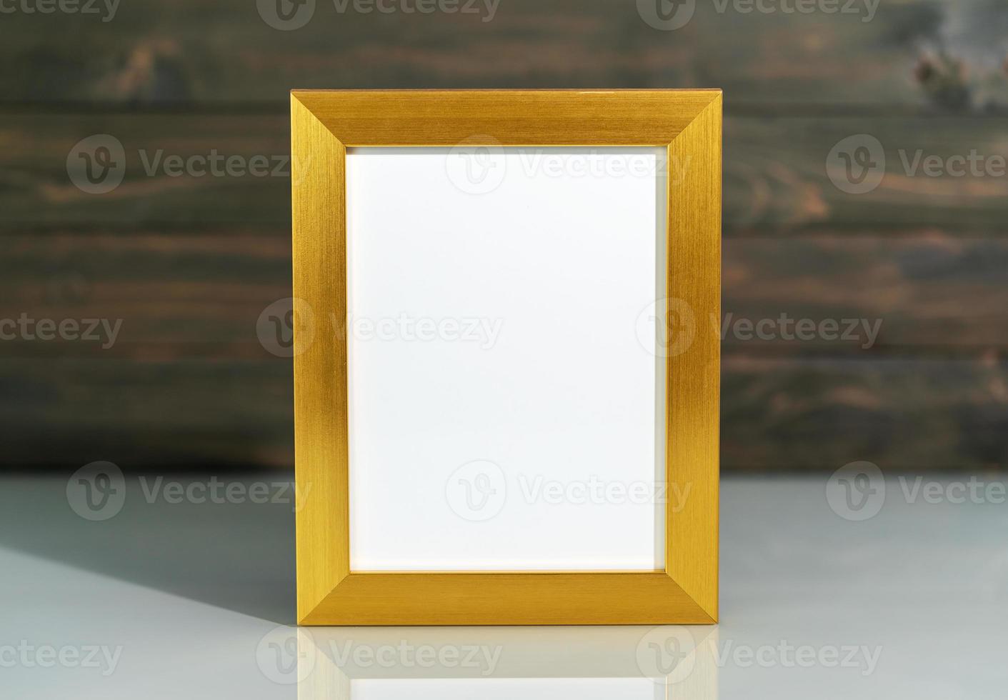 Picture golden frame mock up on table photo