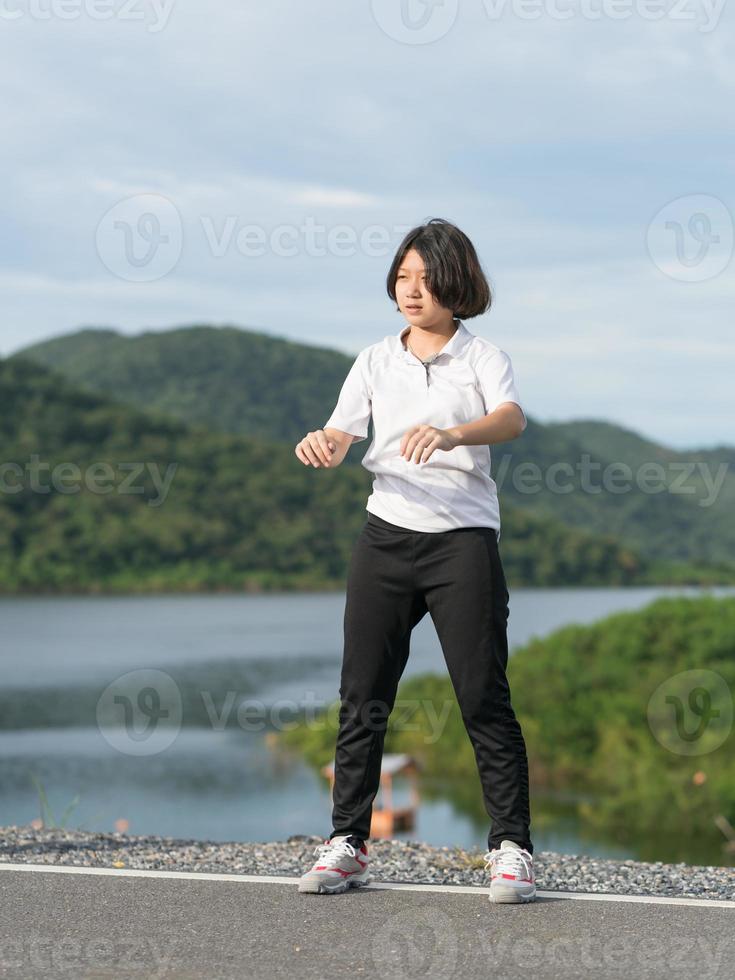 Woman short hair doing exercising outdoor photo