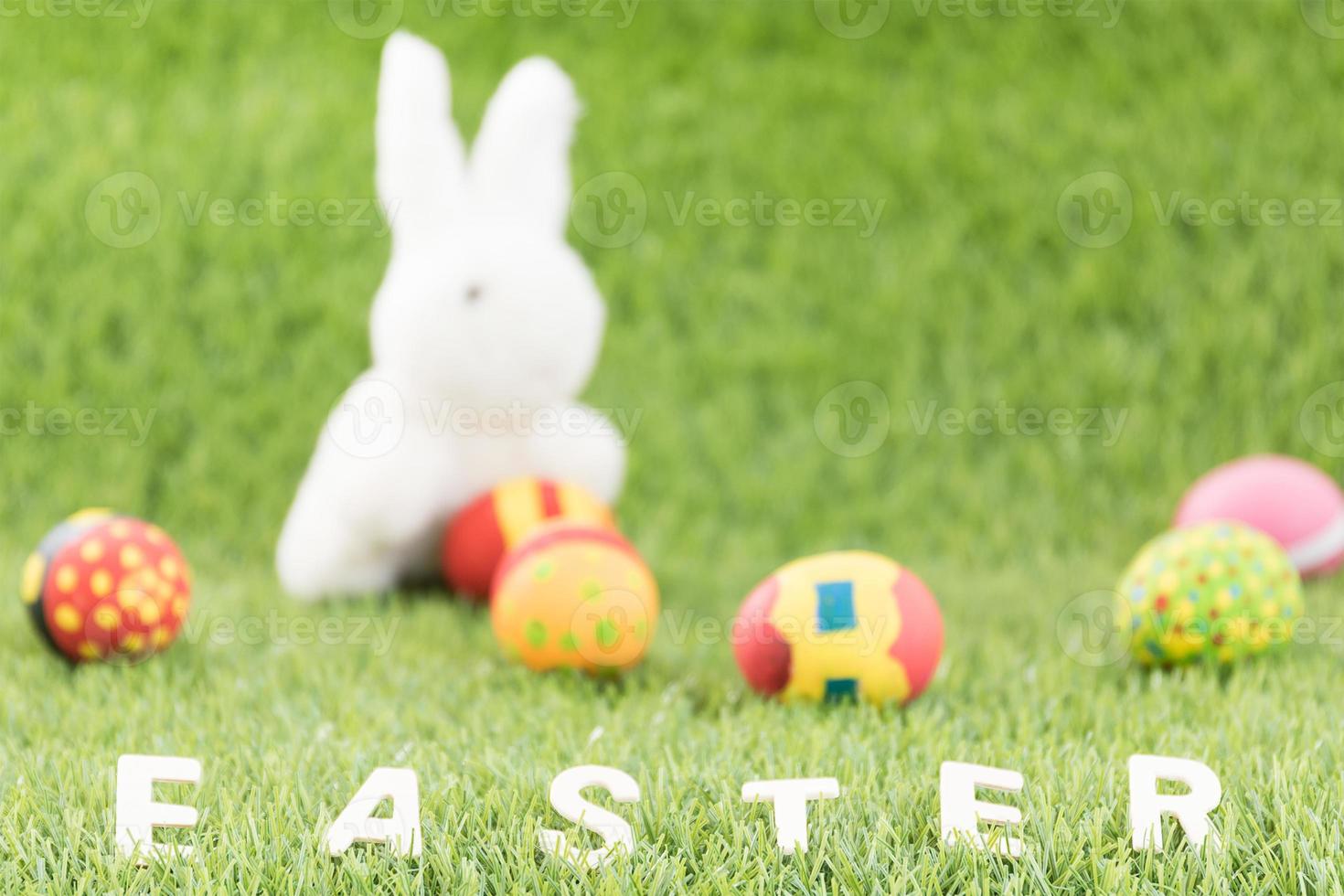 Bunny toys and Easter eggs with text photo