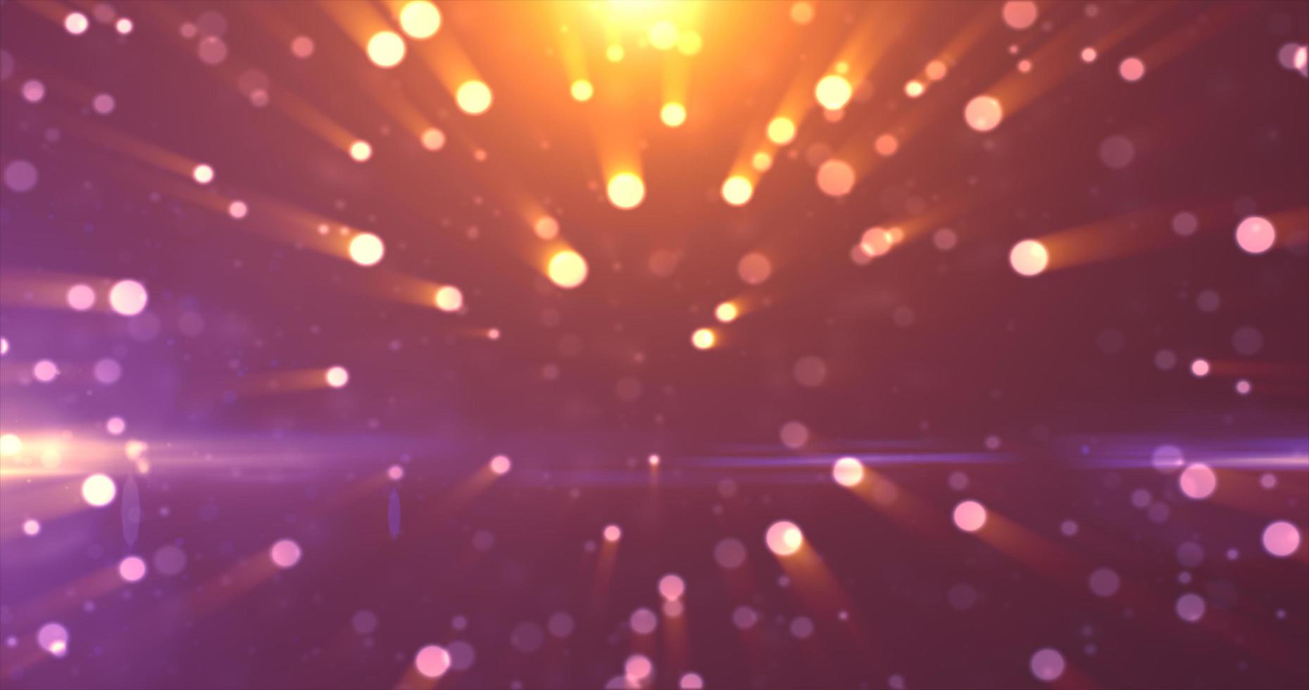 Abstract background of yellow orange gold glowing particles and bokeh dots of festive energy magic photo